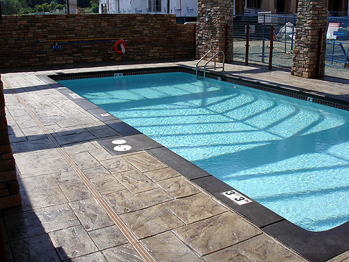 Large Ashler with Stone Skin Border Stamped Concrete Pool
